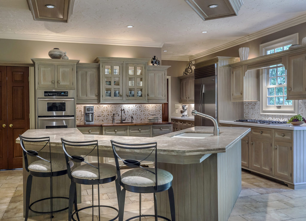 Remodeled kitchen with limestone counters and backsplashes