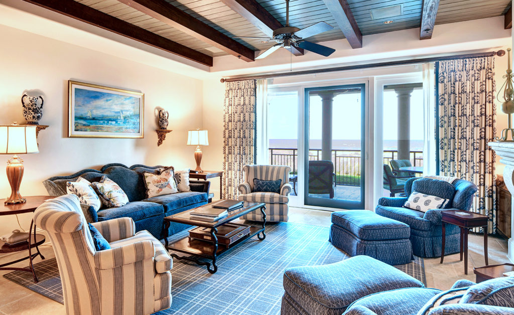 Living room with blue and cream and ocean view