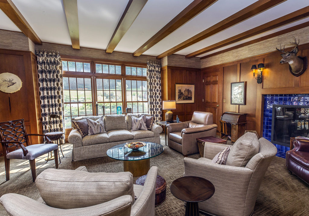 Family room with cherry paneling deer trophy