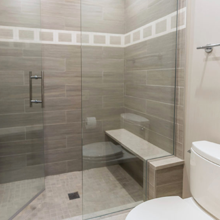 Shower with feature tiles and glass doors