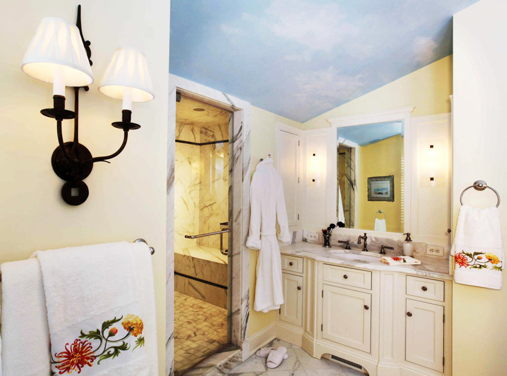 Master bath with yellow walls and sky